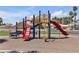 Community playground featuring swings, slides and climbing structures at 5990 Ablette Ave, Las Vegas, NV 89122
