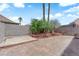 The backyard has stone pavers with greenery at 6374 Horizon Ridge Ct, Las Vegas, NV 89156