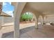 Arched patio with backyard and stone pavers at 6374 Horizon Ridge Ct, Las Vegas, NV 89156