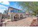 An expansive backyard featuring stone pavers and arches at 6374 Horizon Ridge Ct, Las Vegas, NV 89156