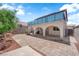 Spacious backyard with stone pavers and patio at 6374 Horizon Ridge Ct, Las Vegas, NV 89156