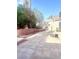 Spacious backyard area with concrete pavers, privacy fence, and landscaped features at 6374 Horizon Ridge Ct, Las Vegas, NV 89156