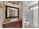 Bathroom featuring a walk-in shower, sink, and dark wooden cabinets at 6374 Horizon Ridge Ct, Las Vegas, NV 89156