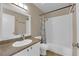 Well-lit bathroom featuring a shower-tub combo and neutral-toned walls at 6374 Horizon Ridge Ct, Las Vegas, NV 89156