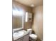 Well-lit half-bathroom with granite countertops, white cabinets, and a stylish vanity mirror at 6374 Horizon Ridge Ct, Las Vegas, NV 89156