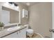 Cozy bathroom featuring vanity, sink, toilet and mirrored cabinet at 6374 Horizon Ridge Ct, Las Vegas, NV 89156