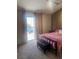Bedroom featuring a walk-out balcony, carpeted floors, and a comfortable sleeping area at 6374 Horizon Ridge Ct, Las Vegas, NV 89156