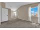 Bedroom with neutral walls, carpet, vaulted ceiling and windows at 6374 Horizon Ridge Ct, Las Vegas, NV 89156