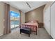 Comfortable bedroom with sliding glass door, and neutral carpet at 6374 Horizon Ridge Ct, Las Vegas, NV 89156