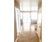 Bright living room with wood-look floors and large windows, offering lots of natural light at 6374 Horizon Ridge Ct, Las Vegas, NV 89156