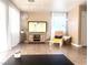 Cozy living room featuring modern decor, wood-look flooring and natural light at 6374 Horizon Ridge Ct, Las Vegas, NV 89156