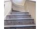 Close-up view of the staircase highlighting the wood-look treads and metal trim at 6374 Horizon Ridge Ct, Las Vegas, NV 89156