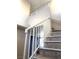 View of the staircase with white railings leading to the second level of the home at 6374 Horizon Ridge Ct, Las Vegas, NV 89156