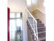 View of the staircase with white railings and wood-look treads, leading to the upper level at 6374 Horizon Ridge Ct, Las Vegas, NV 89156