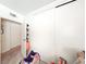 Bedroom closet with white sliding doors and view into hallway and adjacent room at 6630 Bubbling Brook Dr # C, Las Vegas, NV 89107