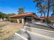 Exterior angle of a building with a red tile roof and well-maintained landscaping at 6630 Bubbling Brook Dr # C, Las Vegas, NV 89107