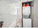 Hallway laundry area with a stackable washer and dryer unit at 6630 Bubbling Brook Dr # C, Las Vegas, NV 89107