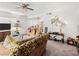 Spacious living room with a sofa, entertainment center, and dining area at 6630 Bubbling Brook Dr # C, Las Vegas, NV 89107