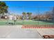 Fenced community tennis court, providing a recreational space for residents to enjoy outdoor sports at 6630 Bubbling Brook Dr # C, Las Vegas, NV 89107