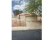 Charming single-story home with a well-maintained front yard and a two-car garage at 6642 Cinnabar Coast Ln, North Las Vegas, NV 89084