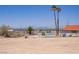 Desert backyard with small pool and distant city views at 6727 E Washington Ave, Las Vegas, NV 89110