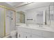Bathroom featuring a double sink vanity and shower stall with a glass door, ample room, and a large mirror at 6727 E Washington Ave, Las Vegas, NV 89110