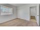 Bedroom with carpet, a window, closet, and an adjacent room, providing a customizable and comfortable space at 6727 E Washington Ave, Las Vegas, NV 89110