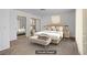 A serene bedroom features a plush bed, mirrored closet doors and soft, neutral colors at 6727 E Washington Ave, Las Vegas, NV 89110