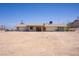Single-story home with sliding glass doors and desert landscaping at 6727 E Washington Ave, Las Vegas, NV 89110