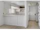 Bright kitchen with white cabinets and tile countertops at 6727 E Washington Ave, Las Vegas, NV 89110