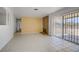 Spacious living room with fireplace and sliding glass door at 6727 E Washington Ave, Las Vegas, NV 89110