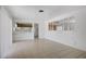 Open-concept living space with tile floors and kitchen access at 6727 E Washington Ave, Las Vegas, NV 89110