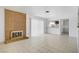 Open living room with tile floors and brick fireplace at 6727 E Washington Ave, Las Vegas, NV 89110