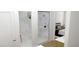 Bright bathroom features a walk in glass shower, white tile and hardwood floors at 6945 Unicorn Street, Las Vegas, NV 89131