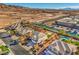 Aerial view showcases a home and its neighborhood with mountain views in the distance at 6971 Cedar Basin Ave, Las Vegas, NV 89142