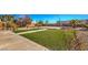 Wide backyard offers a large green space with an entertainment area at 6971 Cedar Basin Ave, Las Vegas, NV 89142