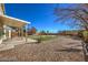 Backyard with lush landscaping and a covered patio, perfect for outdoor entertaining at 6971 Cedar Basin Ave, Las Vegas, NV 89142