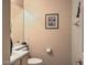 Powder room featuring a white vanity and a framed picture hanging on the wall at 6971 Cedar Basin Ave, Las Vegas, NV 89142