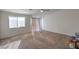 Bright bedroom with a sliding glass door, window and neutral carpet at 6971 Cedar Basin Ave, Las Vegas, NV 89142