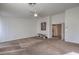Carpeted room with a ceiling fan and neutral walls, offering a blank canvas for personalization at 6971 Cedar Basin Ave, Las Vegas, NV 89142