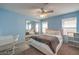 Bright blue bedroom featuring a closet with mirrored doors and carpet at 6971 Cedar Basin Ave, Las Vegas, NV 89142