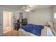 Bedroom featuring a desk, ceiling fan, and ample space for relaxation at 6971 Cedar Basin Ave, Las Vegas, NV 89142