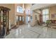 Grand foyer showcases high ceilings, tile flooring, and a decorative chandelier at 6971 Cedar Basin Ave, Las Vegas, NV 89142