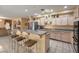 Open kitchen featuring granite countertops, a breakfast bar, and stainless steel appliances, great for entertaining at 6971 Cedar Basin Ave, Las Vegas, NV 89142