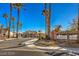 Gated community entrance with lush landscaping and a decorative 'Solitude Estates' sign at 6971 Cedar Basin Ave, Las Vegas, NV 89142