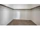 Spacious walk-in closet with carpet and wood shelves and railings at 6971 Cedar Basin Ave, Las Vegas, NV 89142