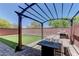 Relaxing backyard has a patio with a pergola and artificial turf, perfect for entertaining at 7104 Flathead River Ave, Las Vegas, NV 89179