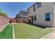 Large backyard boasts a pergola covered patio with artificial turf for year-round enjoyment at 7104 Flathead River Ave, Las Vegas, NV 89179