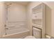 Bright bathroom features a shower-tub, a toilet, and a built-in storage at 7104 Flathead River Ave, Las Vegas, NV 89179