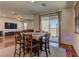 Bright dining area with wood floors, access to backyard, and flows into the living room at 7104 Flathead River Ave, Las Vegas, NV 89179